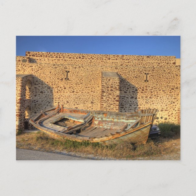 Greece, Santorini, Oia. Old fishing boat on dry Postcard (Front)
