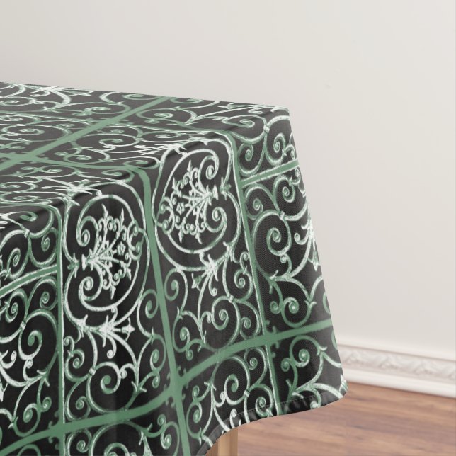 Green and black scrollwork pattern tablecloth (In Situ)