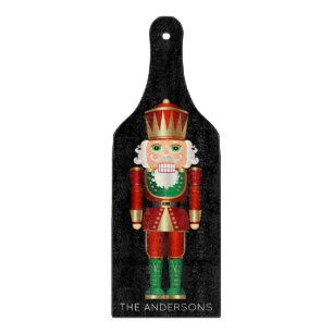 Green and Gold Nutcracker on Black Cutting Board