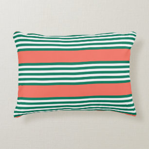 Green and white five stripe pattern with coral accent pillow
