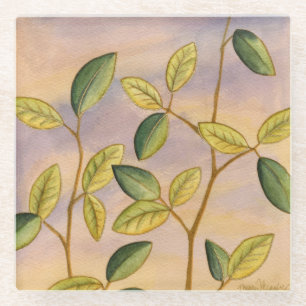 Green and Yellow Leaves on Sunset Background Glass Coaster