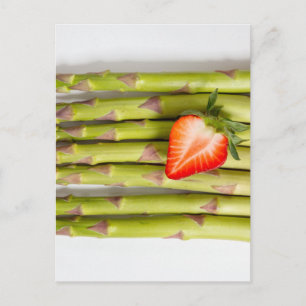 Green asparagus with strawberries top view postcard