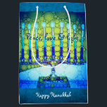 Green Blue Hanukkah Menorah Peace Love Light Medium Gift Bag<br><div class="desc">“Peace, love & light.” A close-up photo illustration of a bright, colourful, blue and green artsy menorah helps you usher in the holiday of Hanukkah in style. Feel the warmth and joy of the holiday season whenever you use this cute and fun personalized medium size gift bag. Matching cards, postage,...</div>