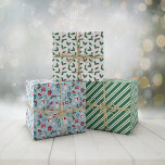 Green Blue Red Cute Cozy Christmas Patterns Wrapping Paper Sheet<br><div class="desc">Cute Christmas wrapping papers in three matching designs. One with snowmen,  Santas,  spruce needles,  steaming cups of cocoa,  and more. One with holly,  and one with green and white stripes.</div>