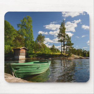 Green boat in a fjord in Norway mousepad