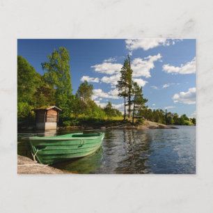 Green boat in a fjord in Norway postcard