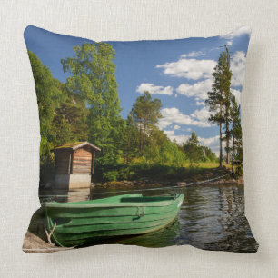 Green boat in a fjord in Norway Throw Pillow