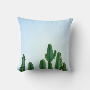 Green cactus plant in white background throw pillow