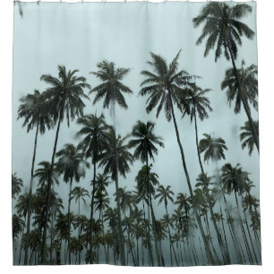 Green coconut trees under white sky in the morning