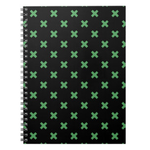 Green cross stitches on black notebook