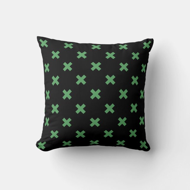 Green cross stitches on black throw pillow (Front)