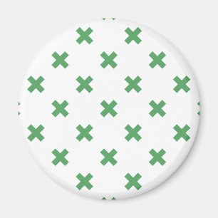 Green cross stitches on white magnet