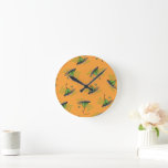 Green Eggs and Ham Pattern Round Clock<br><div class="desc">This officially licensed Dr. Seuss design features a seamless, repeating pattern of the classic green eggs and ham on a platter illustration. The iconic dish is scattered across a solid orange background, accompanied by the text "Green Eggs and Ham" in a matching green font. This nostalgic and recognizable pattern perfectly...</div>