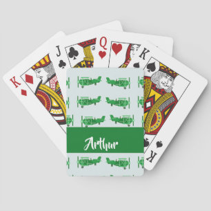 Green flying airplanes on blue playing cards