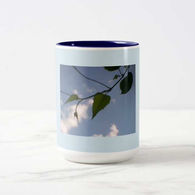 Green Foliage in Deep Blue Sky Two-Tone Coffee Mug (Center)