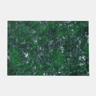 Green fungus upon whitish grey rock or tree trunk doormat