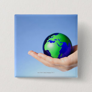 Green globe in hand 2 inch square button
