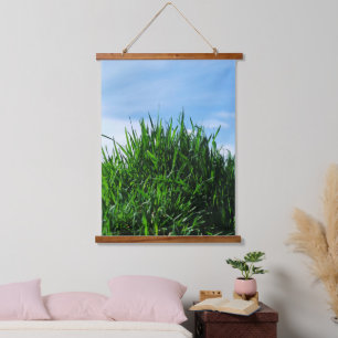 Green grass against the background of the endless  hanging tapestry