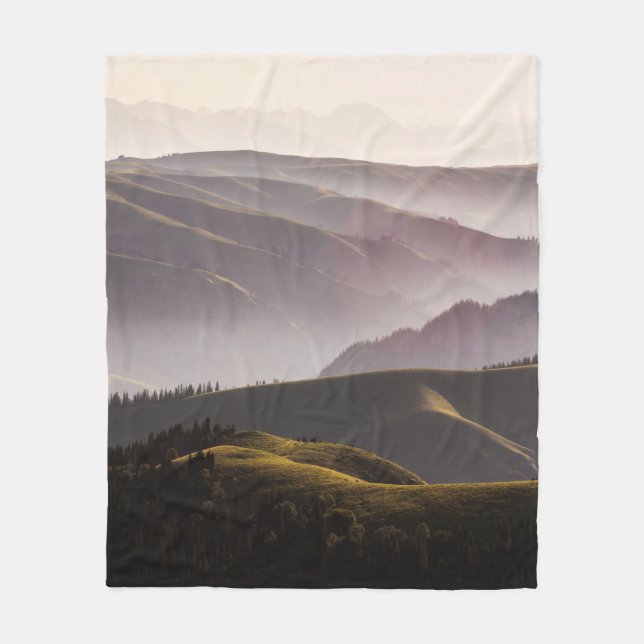 GREEN GRASS FIELD AND MOUNTAINS DURING DAYTIME FLEECE BLANKET (Front)