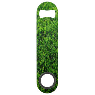 Green grass texture from a soccer field speed bottle opener