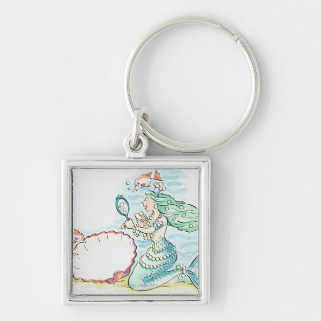Green-haired mermaid wearing large selection of keychain (Front)