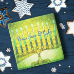 Green Hanukkah Menorah Peace Love Light Script Stone Coaster<br><div class="desc">“Peace, love & light.” A close-up photo of a bright, colourful, green and yellow artsy menorah helps you usher in the holiday of Hanukkah in style. Feel the warmth and joy of the holiday season whenever you relax with your favourite beverage on this stunning, colourful Hanukkah stone coaster. Makes a...</div>