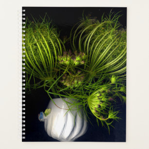 Green heart in black planner