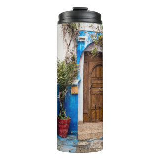 GREEN LEAFED PLANT NEAR WALL THERMAL TUMBLER