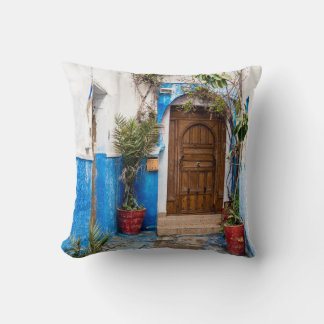 GREEN LEAFED PLANT NEAR WALL THROW PILLOW