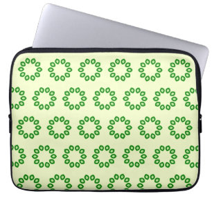 Green leaves in a circle on yellow  laptop sleeve