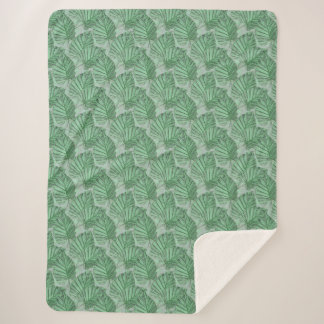 Green leaves on a grey stone. sherpa blanket