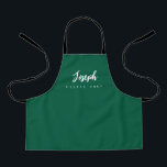 Green Little Chef Script Name personalized Kids Apron<br><div class="desc">Make your little chef feel extra special with our Green Little Chef Script Name Personalized Kids Apron. This apron is designed to provide a simple, chic, and elegant look, featuring stylish script typography for personalizing the name. The purple background colour adds a touch of vibrancy and fun, perfect for engaging...</div>