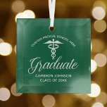 Green Medical School Graduation Christmas Glass Ornament<br><div class="desc">This custom green medical school graduation Christmas ornament for a nurse or doctor features white typography under a medical caduceus for the class of 2025. Customize with your graduating year under the elegant calligraphy for a great personalized university graduate gift.</div>
