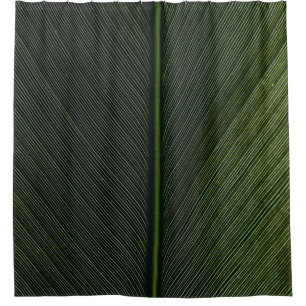 Green metal rod on black and white pinstripe texti