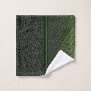 Green metal rod on black and white pinstripe texti wash cloth