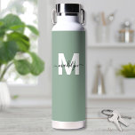 Green Modern Name Monogram Water Bottle<br><div class="desc">Create Your Own Personalized Sage Green Name Monogram Water Bottle. This cute and stylish water bottle features a soft sage green background for an earthy, calming vibe. A bold white initial sits in the centre, overlaid by a flowing black script name for a personalized touch on both sides. Ideal for...</div>