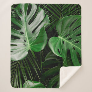 Green monstera leaves and palm leaves sherpa blanket