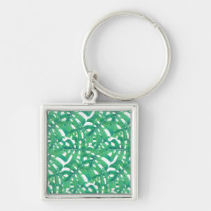 Green monstera tropical leaves pattern on white b keychain