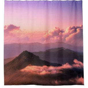 GREEN MOUNTAIN SURROUNDED BY CLOUDS