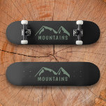 Green Mountains Black Skateboard<br><div class="desc">A black skateboard with green mountains and customizable text for lovers of hiking & outdoor adventures!</div>