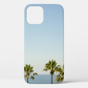 Green palm tree under white sky in the morning iPhone 12 case