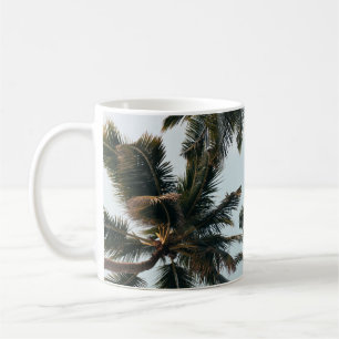 Green palm tree under white sky in the morning coffee mug
