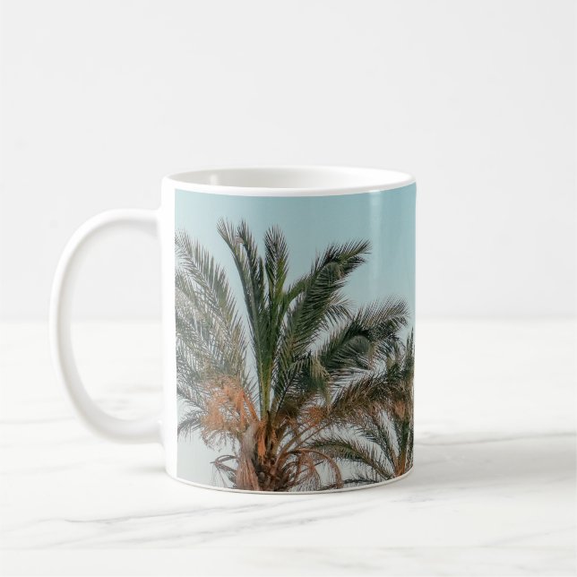 GREEN PALM TREES UNDER BLUE SKY COFFEE MUG (Left)