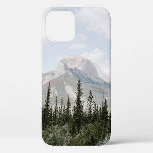 GREEN PINE TREES NEAR MOUNTAIN UNDER WHITE CLOUDS iPhone 12 CASE
