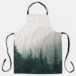 GREEN PINE TREES ON FOGGY WEATHER APRON