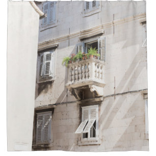 GREEN POTTED PLANT ON BROWN CONCRETE HOUSE BALCONY