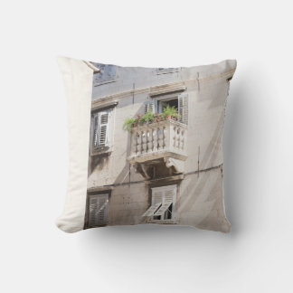 GREEN POTTED PLANT ON BROWN CONCRETE HOUSE BALCONY THROW PILLOW