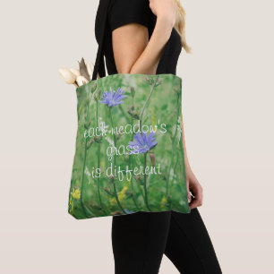 Green summer meadow with blue flowers  tote bag