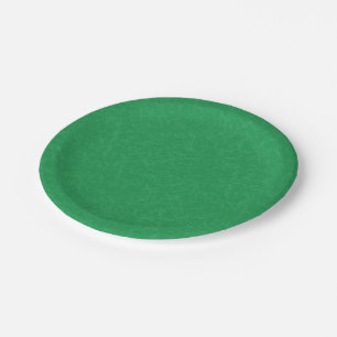 Green textured surface with swirling pattern paper plate
