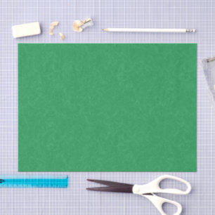Green textured surface with swirling pattern tissue paper
